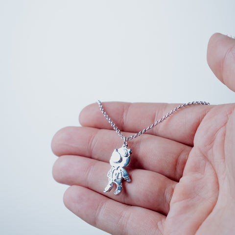 Silver-plated Graduation Necklace – worn on hand | Above Average
