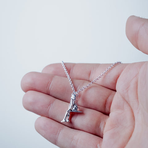 Silver-plated SOS Necklace – worn on hand | Above Average