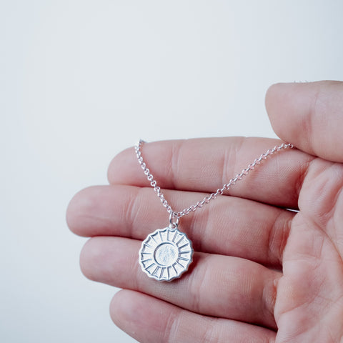 Silver-plated The Divine Feminine Necklace – worn on hand | Above Average