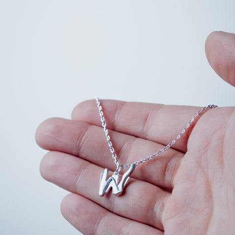 Silver-plated Wasteland Necklace – worn on hand | Above Average